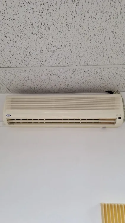 Technician providing air conditioner installation service in Durban North